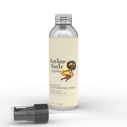 Kaylas Kurlz Organics  Sacred Shore Hair Mist  Sea Salt Texturizing Hair Spray bottle of Sacred Shore Hair Mist Sea Salt Texturizing Hair Spray with label featuring product information against a white background.