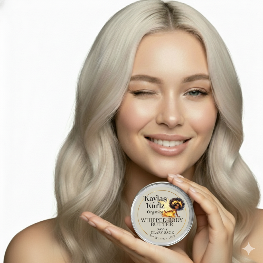 Woman with lose curly blonde hair holding a container of Kaylas Kurlz Sassy Clary Sage Whipped Body butter.