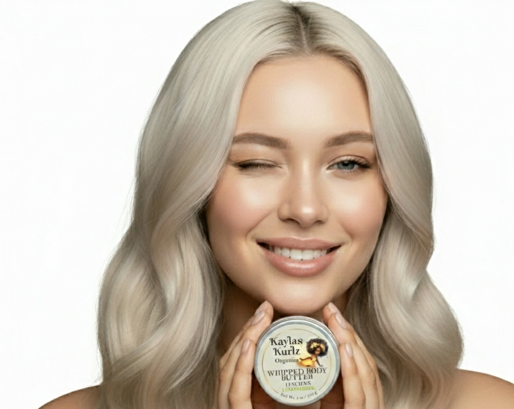 Woman holding a container of Kayla's Kurlz Organics Lovely Lavendar Whipped Body Butter in her hands as she winks her eye.